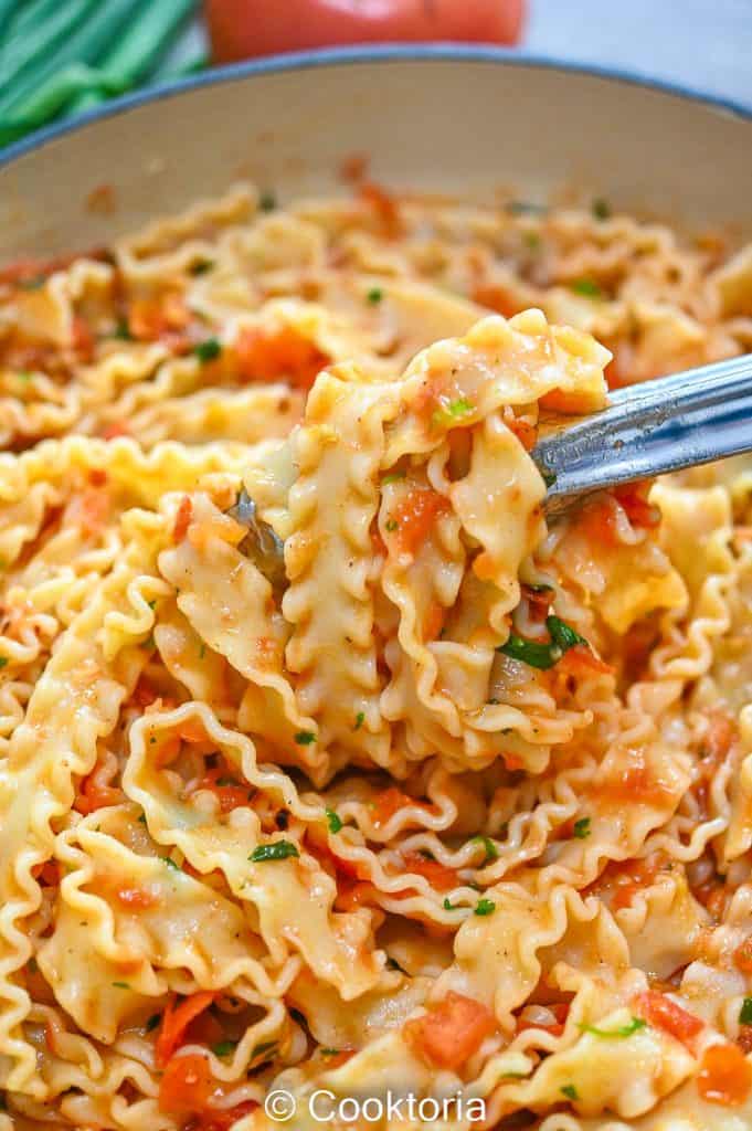 Lifting Mafaldine Pasta with tongs